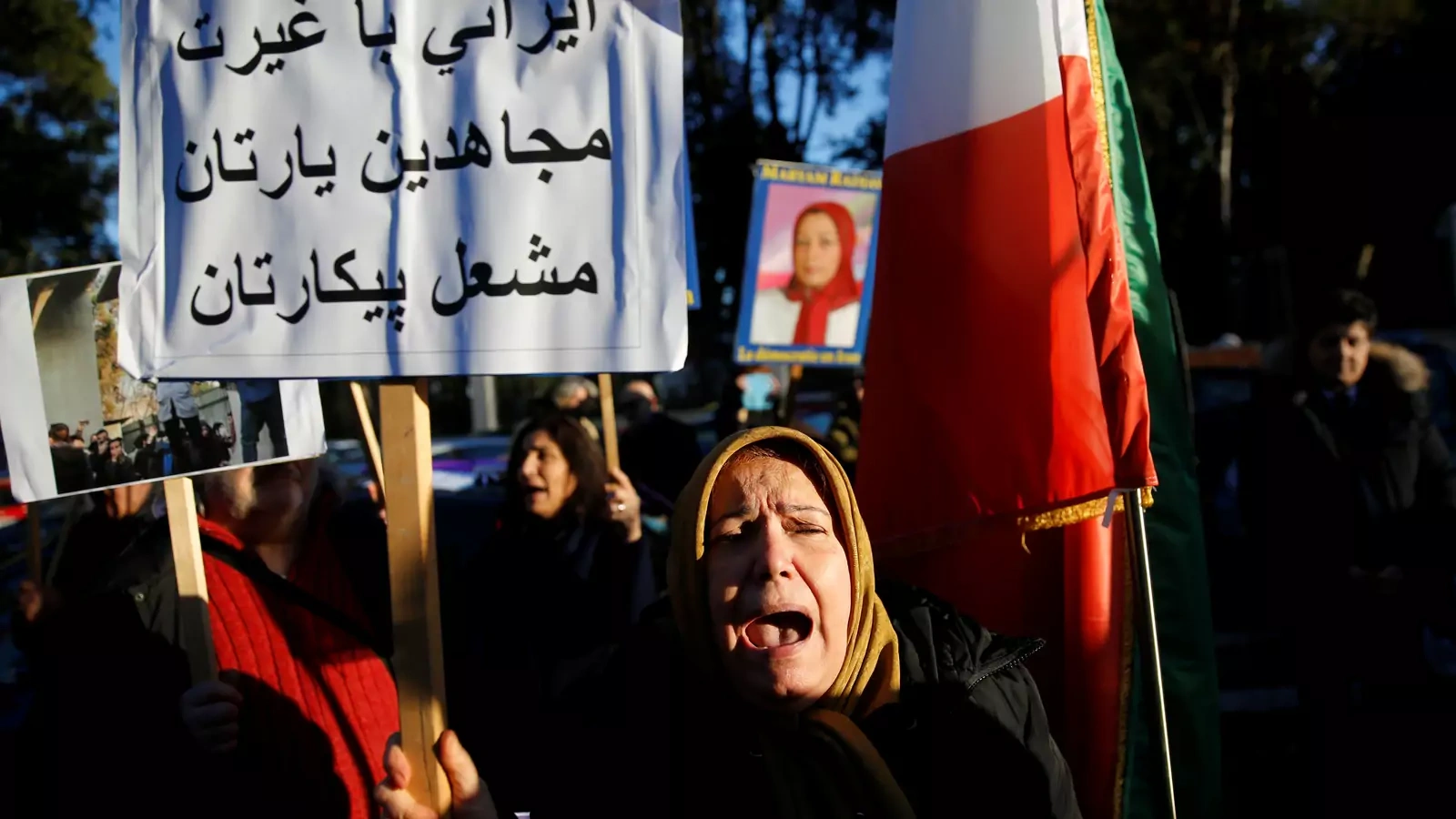 Opponents of Iranian President Hassan Rouhani hold a protest outside the Iranian embassy in Rome, Italy, on January 2, 2018.
