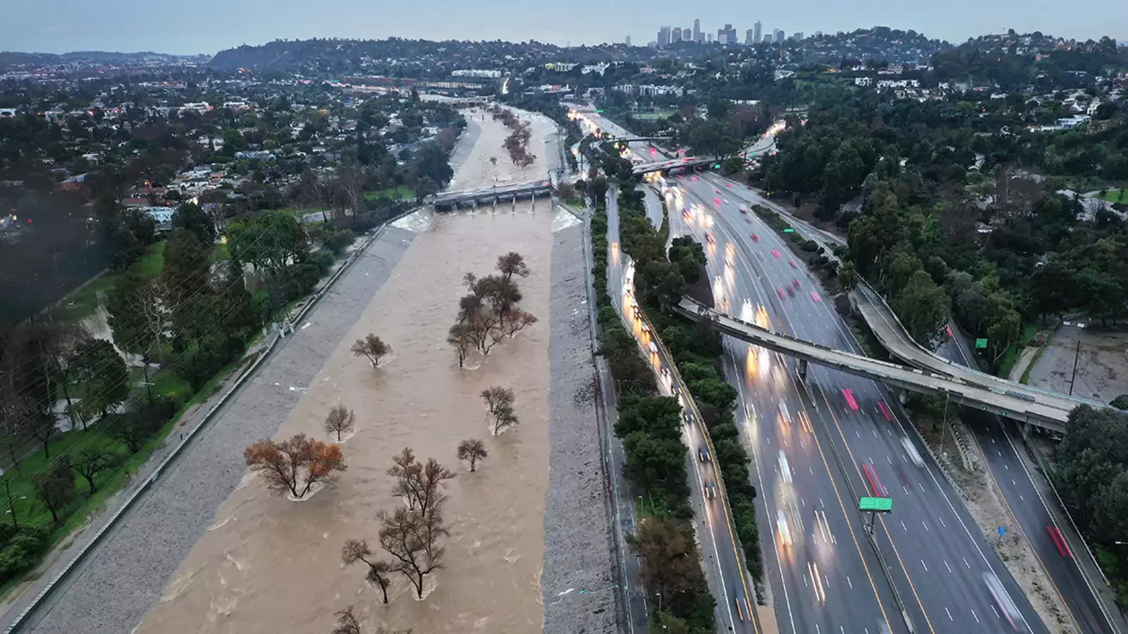 The Los Angeles River swells after an atmospheric river dropped seven inches of rain in February 2024.