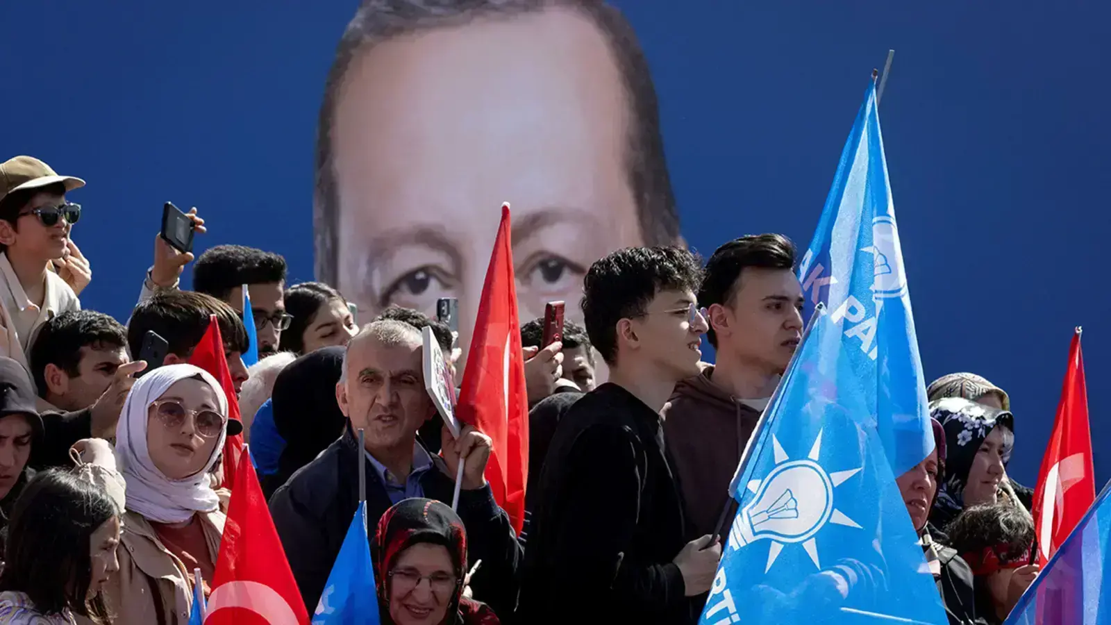 Supporters of Turkish President Recep Tayyip Erdogan listen to his speech during a rally ahead of local elections in Istanbul, Turkey, in March 2024.