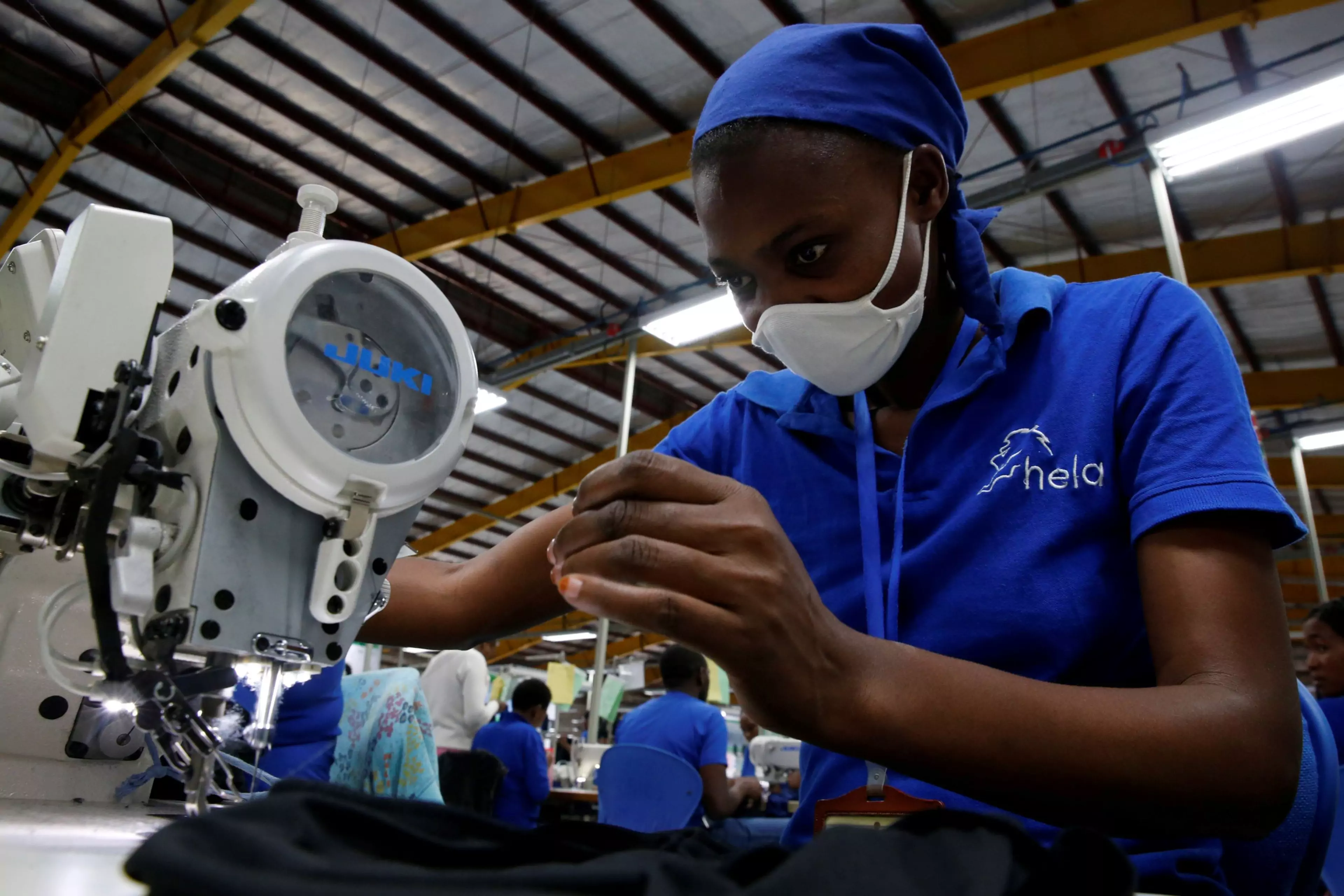 A worker sews at an export processing zone factory in Athi River, Kenya.