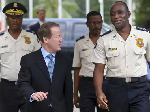 U.S. Assistant Secretary of State for International Narcotics and Law Enforcement Affairs William Brownfield speaks with Mario Andresol, director general of the Haitian Police Force, in Port-au-Prince