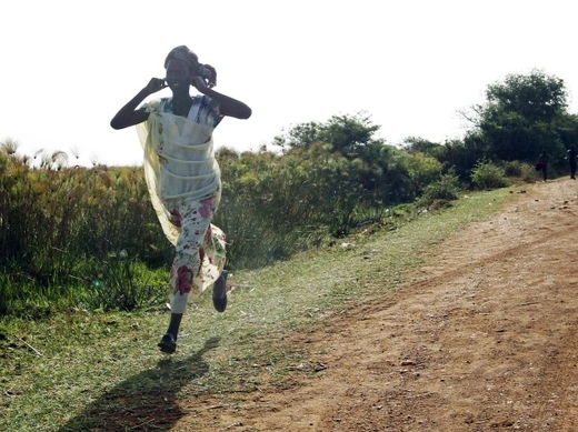 Woman running Sudan
