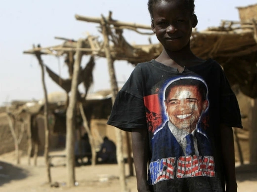 A Sudanese child from the south, wearing a t-shirt with the picture of U.S. President Barack Obama, stands near a shelter at Mandela camp, in the outskirts of Khartoum, July 4, 2011.