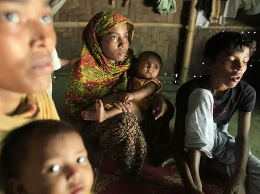 Rohingya women and children hide in a house in Teknaf