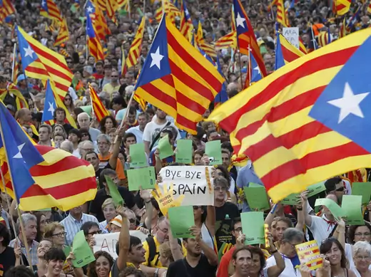 Marchers wave Catalonian nationalist flags during a demonstration on Catalan National Day in Barcelona on September 11, 2012 (Albert Gea/Courtesy Reuters).