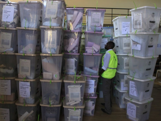 An official from the Independent Electoral and Boundaries Commission (IEBC) inspects ballot boxes at Kasarani gymnasium in Kenya's capital Nairobi March 5, 2013.