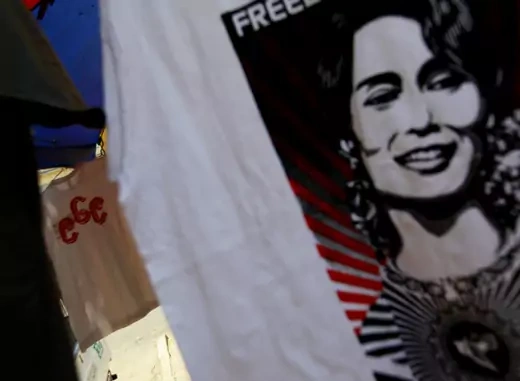 A 969 shirt is seen among National League for Democracy party shirts and Aung San Suu Kyi shirts at a shop on a street side in Yangon on April 27, 2013. (Soe Zeya Tun/Courtesy Reuters) 