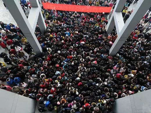 Examinees walk into the entrance of a classroom building to take part in a three-day entrance exam for postgraduate studies, at Anhui University, in Hefei, Anhui province on January 5, 2013 (Stringer/Courtesy Reuters).