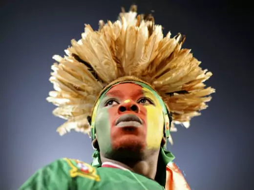 A fan waits for the start of a 2010 World Cup Group E soccer match between Cameroon and Denmark at Loftus Versfeld stadium in Pretoria, June 19, 2010. (Dylan Martinez/Courtesy Reuters)