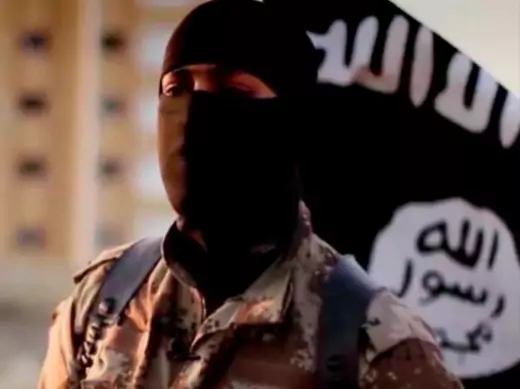 A masked man speaking in what is believed to be a North American accent in a video released by Islamic State in Iraq and Syria (ISIS) militants in September 2014 is pictured in this still frame from video obtained by Reuters (Courtesy Reuters/FBI/Handout via Reuters).