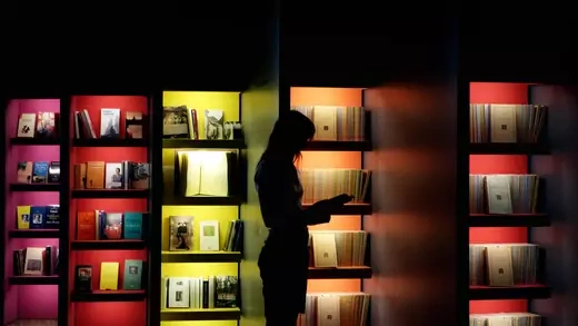 woman looks into a book