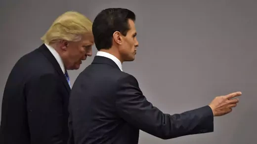 Mexican President Enrique Peña Nieto is followed by then-presidential candidate Donald J. Trump after a meeting in August 2016 in Mexico.