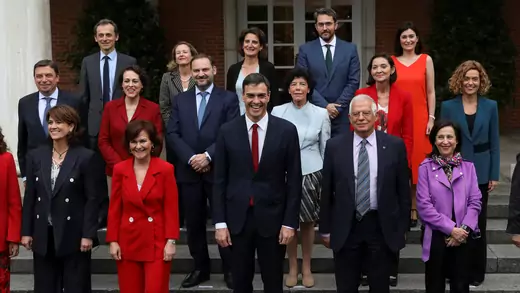 Spain's new Prime Minister Pedro Sanchez poses with new government members for a family photo following their first cabinet meeting.