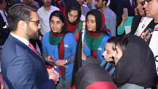 Ambassador Mohib with the Afghan Girls' Robotics Team. 