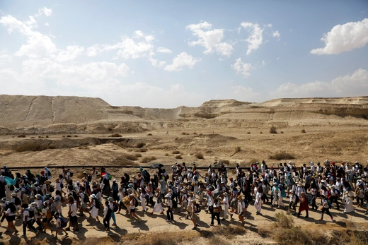 Israeli and Palestinian women march together as part of an event organized by "Women Wage Peace," group calling for an end to the Israeli-Palestinian conflict, near the Jordan River. October 8, 2017. 