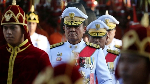 Prayuth Chan-ocha wears a white military uniform. 