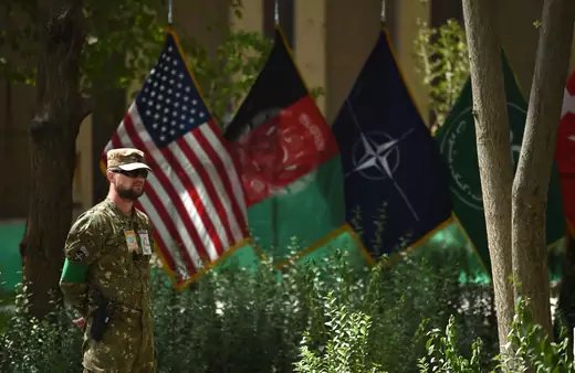 A member of the NATO military forces stands guard during a change of command ceremony at Resolute Support in Kabul on September 2, 2018.