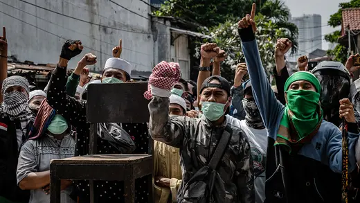 Protesters shout during a demonstration in Jakarta after official election results were announced.