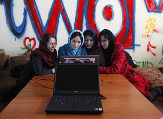 Afghan girls at the first Internet cafe for women in Kabul, Afghanistan. March 8, 2012.