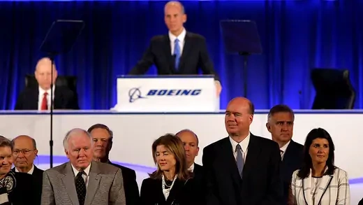 A group of officals at a Boeing shareholder meeting
