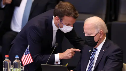 Emmanual Macron and Joe Biden speak at the 2021 NATO summit