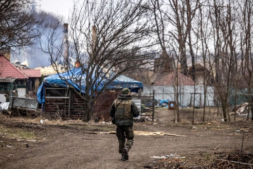 A Ukrainian serviceman walks at the frontline, east of Kharkiv, on March 31, 2022, during Russia's military invasion on Ukraine.