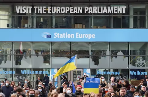 People carry flags and banners at a protest of members of the European Parliament and citizens, including Ukrainian living in Belgium, in support of Ukraine and against the war, amid Russia's invasion of Ukraine, in Brussels, Belgium on March 1, 2022.