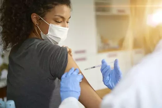 Woman gets covid-19 vaccine 