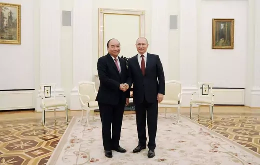 Russia's President Vladimir Putin shakes hands with Vietnam's President Nguyen Xuan Phuc during a meeting in Moscow, Russia November 30, 2021.