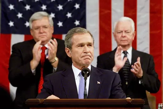 George W. Bush at podium given State of the Union address in Congress.