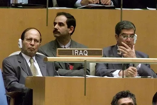 Members of the Iraqi delegation listen to U.S. President George W. Bush's address to the 57th session of the United Nations General Assembly