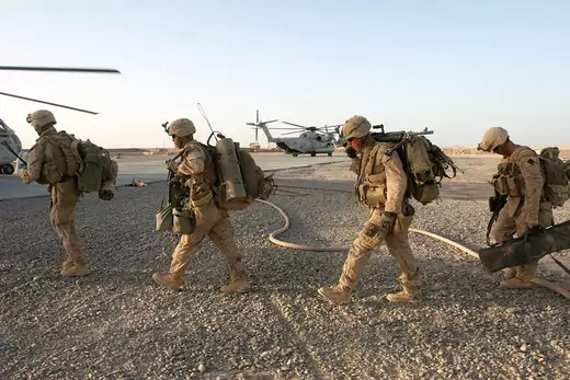 U.S. Marines  prepare to board CH-53D Sea Stallion and CH-53E Super Stallion helicopters.