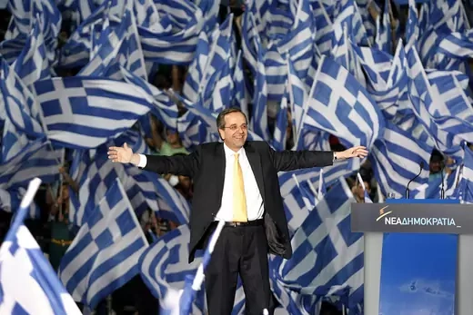  Antonis Samaras surrounded by Greek flags, addresses supporters during a pre-election rally