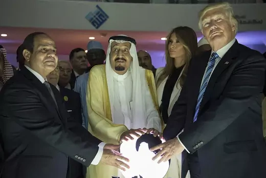 Egyptian President Abdel Fattah el-Sisi, Saudi Arabia's King Salman bin Abdulaziz al-Saud and Donald Trump hold an illuminated globe during an inauguration ceremony.