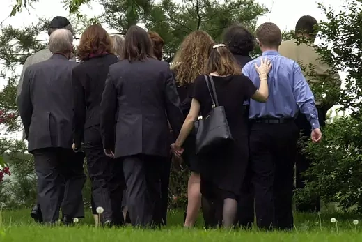 Family members of slain American Nicholas Berg consoles each other as they walk to a memorial service for him in West Chester, Pa., Friday, May 14, 2004.