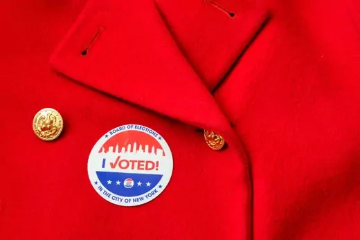 I voted sticker on a red coat