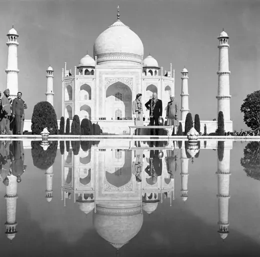 President Dwight D. Eisenhower and his daughter-in-law, Barbara, stand with Indiaís Prime Minister Jawaharlal Nehru, right, before pool on the grounds of the Taj Mahal.