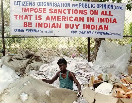 A banner encourages the boycott of U.S. goods after Washington imposed economic sanctions on India. 