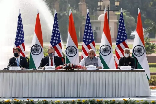 U.S. Secretary of Defense Mark T. Esper and Secretary Pompeo sit at a long table with Indian Defense Minister Rajnath Singh and External Affairs Minister Subrahmanyam Jaishankar during a press conference in New Delhi.