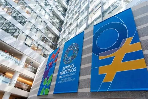 Spring Meetings signs are displayed in the International Monetary Fund (IMF) headquarters in Washington, DC, on April 12, 2023.