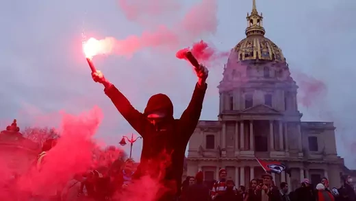Protester raises flares in Paris