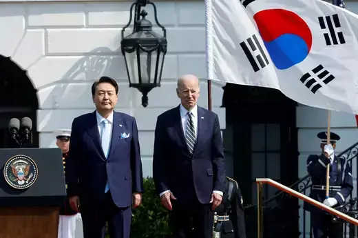 U.S. President Joe Biden and South Korean President Yoon Suk-yeol stand together during an official White House state arrival ceremony at the White House in Washington on April 26, 2023. 
