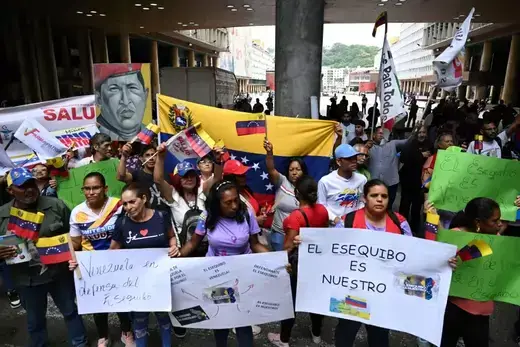 People gather in front of Venezuela's National Electoral Council headquarters in support of the referendum on a disputed zone with Guyana in Caracas, Venezuela on October 20, 2023.