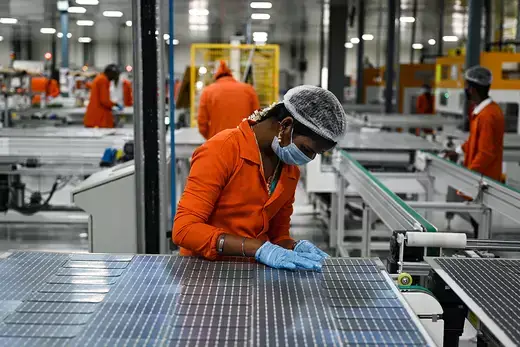 An employee connects solar cells at a manufacturing plant in Oragadam, in the south Indian state of Tamil Nadu. Currently, Coal powers 70 percent of India’s electricity generation.