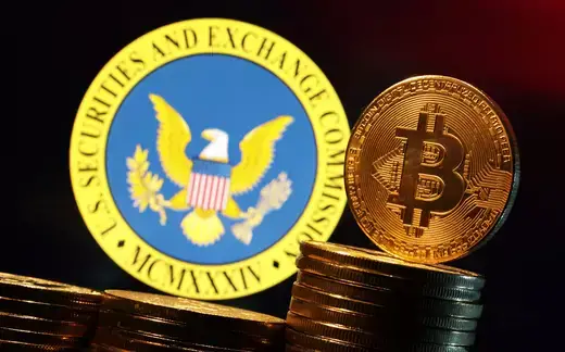 The logo of the U.S. Securities and Exchange Commission and a representation of Bitcoin cryptocurrency are seen in this illustration.