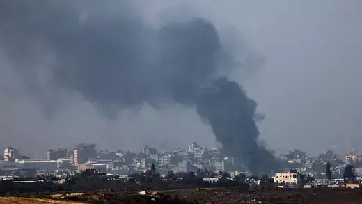 Smoke rises over northern Gaza following Israeli air strikes in Dec 2023.