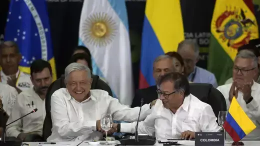 Colombian President Gustavo Petro (R) shake hands with his Mexican counterpart, Andres Manuel Lopez Obrador.