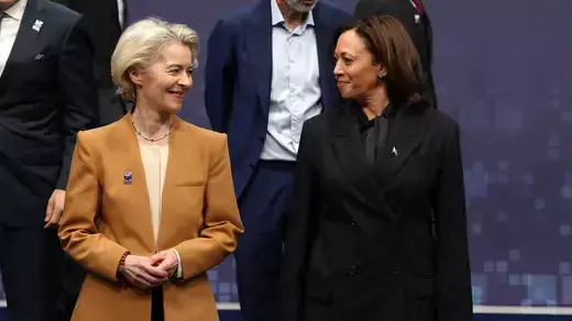 European Commission President Ursula von der Leyen (L) and US Vice President Kamala Harris (R) smile at each other.