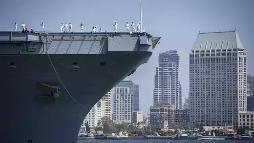 Sailors man the rails aboard Nimitz-class nuclear aircraft carrier USS Carl Vinson (CVN 70) at the Port of San Diego.