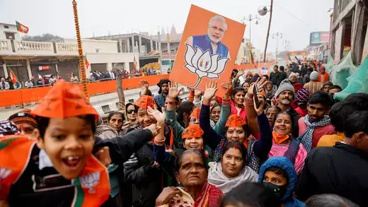 Supporters of Bharatiya Janata Party (BJP) react after India's Prime Minister Narendra Modi's roadshow in Ayodhya.